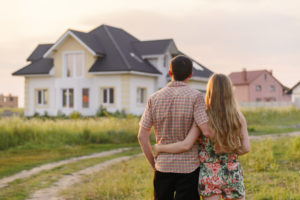 Young couple looking at house