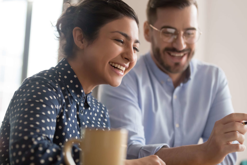 Woman and man laughing together