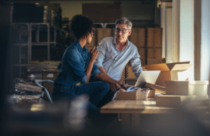 Woman and man organizing small business